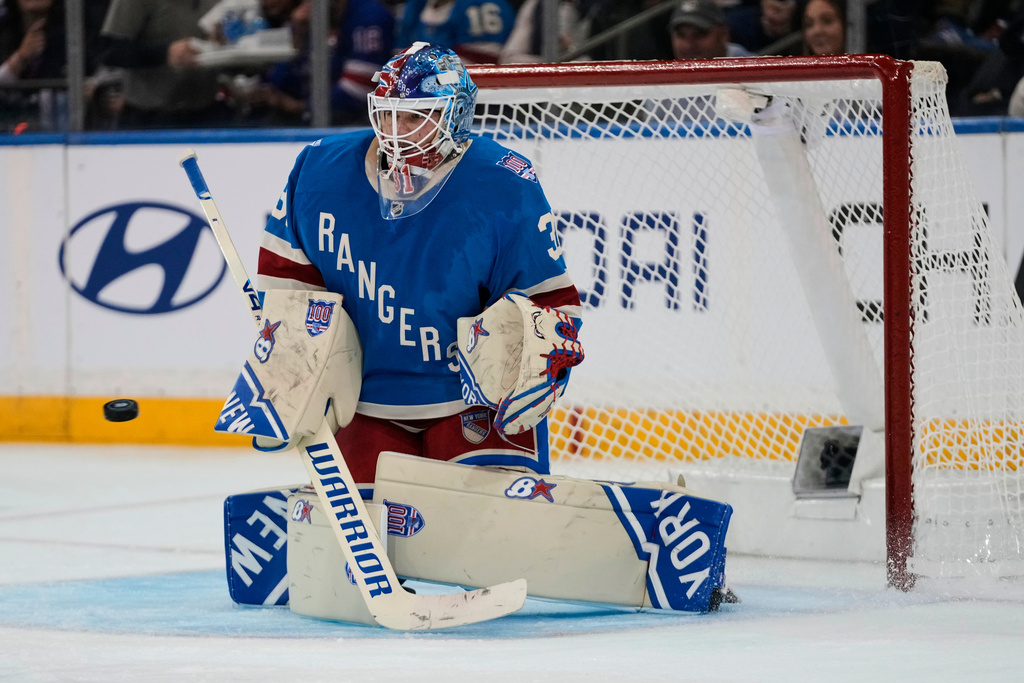 New York Rangers goaltender Igor Shesterkin (31) stops a shot during the second period of an NHL hockey game against the Minnesota Wild Monday, Oct. 20, 2025, at Madison Square Garden in New York. (AP Photo/Frank Franklin II)