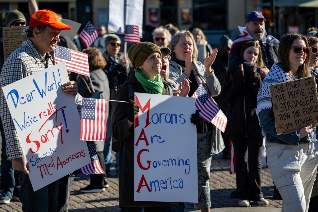People take part in a No Kings protest, in Malmö, Sweden, Saturday, Oct. 18, 2025. (Johan Nilsson/TT News Agency via AP)