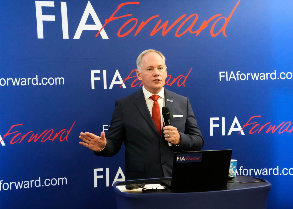 FILE - Tim Mayer, the son of former McLaren team principal Teddy Mayer addresses the media after announcing that he is running for the presidency of motorsport's governing body the FIA in December's election, in Whittlebury Park, England, Friday, July 4, 2025. (AP Photo/Darko Bandic, file )