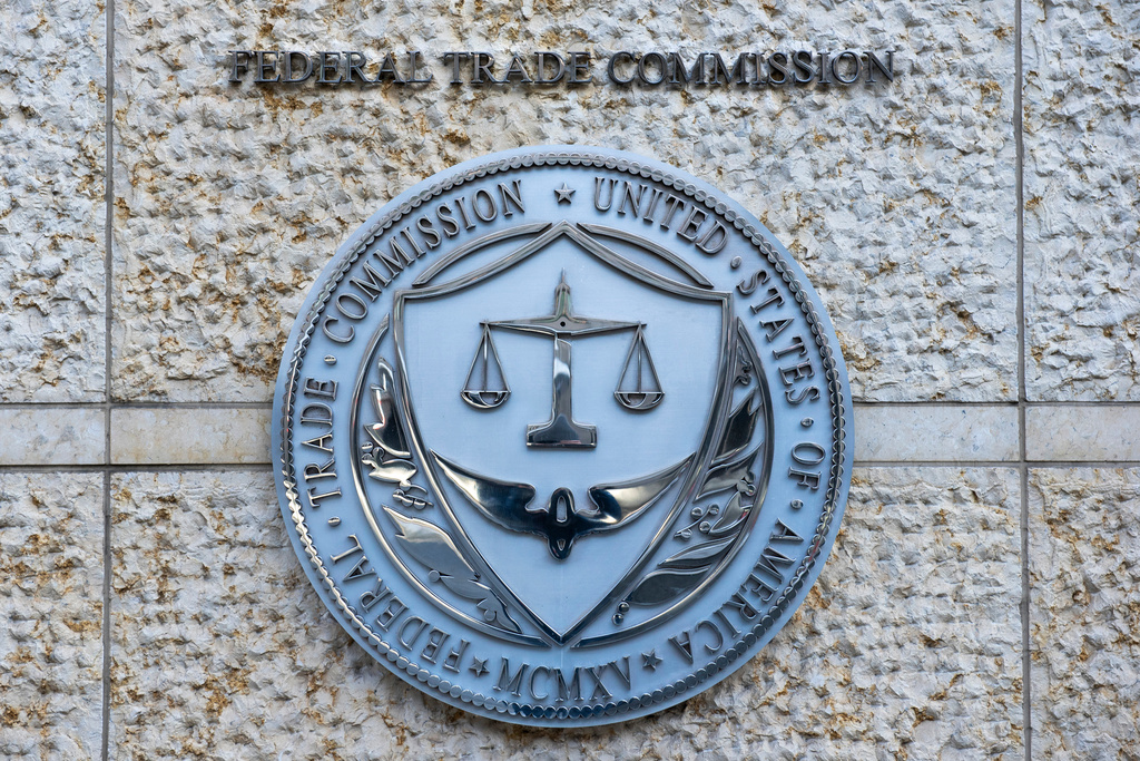 FILE - The official seal of the Federal Trade Commission is seen on an office building in Washington, Feb. 13, 2026. (AP Photo/Cliff Owen, File)