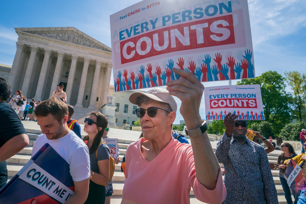 FILE - Immigration activists rally outside the Supreme Court as the justices hear arguments over the Trump administration's plan to ask about citizenship on the 2020 census in Washington, April 23, 2019. (AP Photo/J. Scott Applewhite, File)