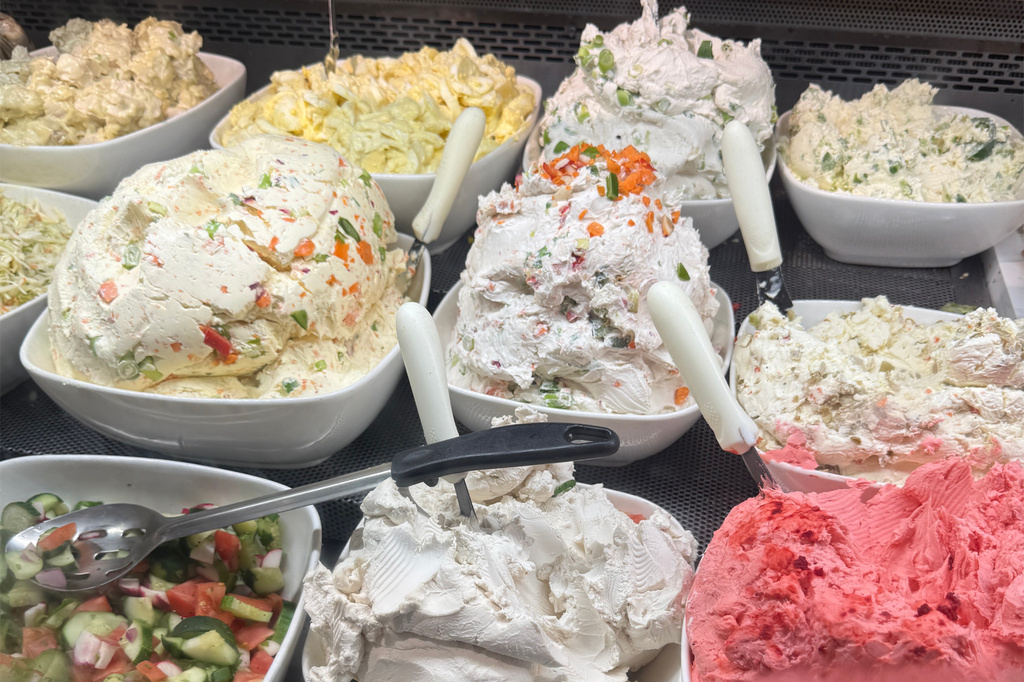 Various cream cheeses and bagel fixings appear at Tal Bagels in New York on Sept. 13, 2026. (Katie Workman via AP)