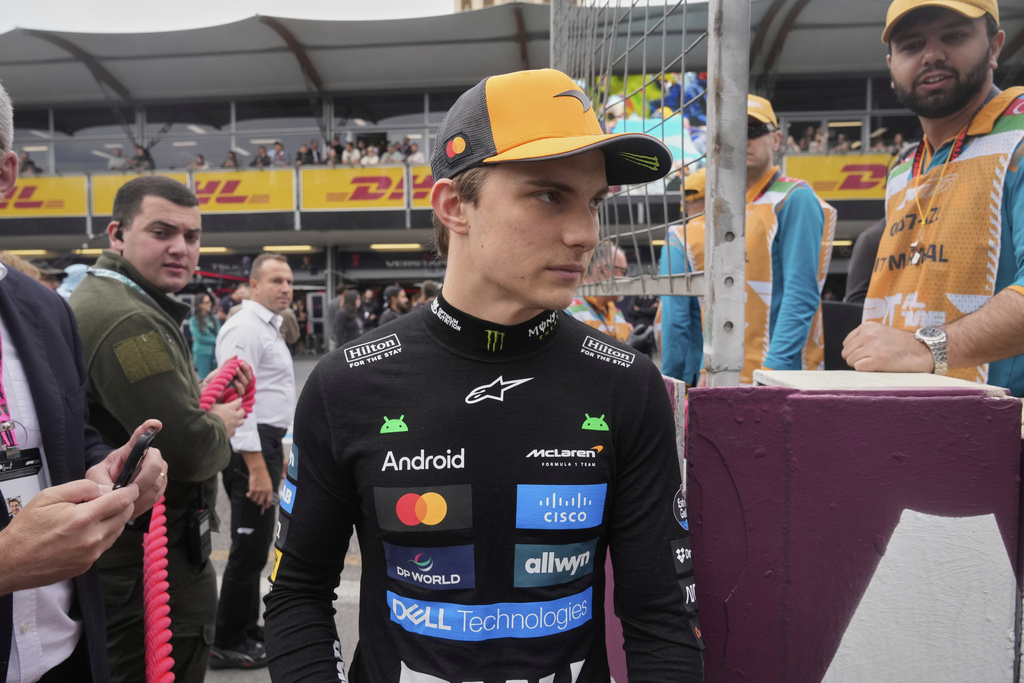 McLaren driver Oscar Piastri of Australia arrives at the starting grid for the Azerbaijan Formula One Grand Prix in Baku, Azerbaijan, Sunday, Sept. 21, 2025. (AP Photo/Darko Bandic)