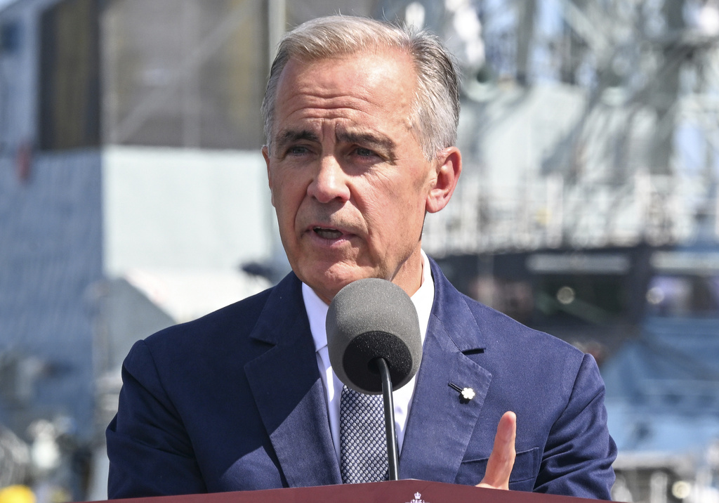 Canadian Prime Minister Mark Carney speaks at the Davie shipyard in Levis, Quebec on Monday, Aug. 24, 2026. (Jacques Boissinot/The Canadian Press via AP)