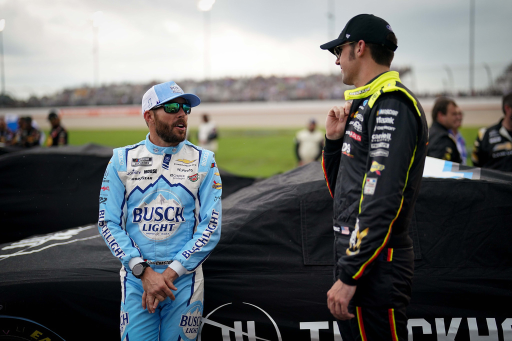 Ross Chastain, left, talks with Ryan Blaney, right, before a NASCAR Cup Series auto race, Sunday, May 31, 2026, in Lebanon, Tenn. (AP Photo/Camden Hall)