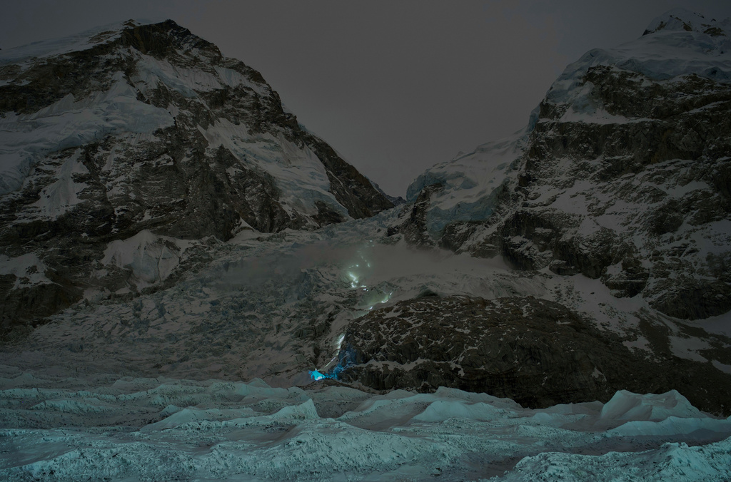 A trail of mountaineers' headlamps is visible from Everest Base Camp as climbers ascend toward the summit of Mount Everest, Nepal, Thursday, April 30, 2026. (AP Photo/Pasang Rinzee Sherpa)
