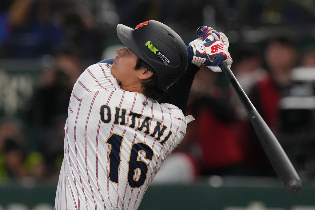 Japan's Shohei Ohtani hits a home run during the third inning of a World Baseball Classic game between Japan and South Korea on Saturday, March 7, 2026 in Tokyo, Japan. (AP Photo/Eugene Hoshiko)