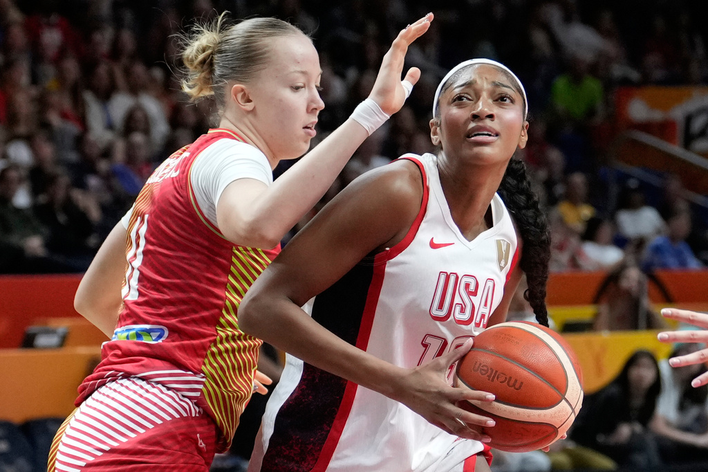 Hungary's Kinga Josepovits guards Angel Reese, of the United States, during the Women's Basketball World Cup quarterfinal match between the United States and Hungary in Berlin, Thursday, Sept. 10, 2026. (AP Photo/Ebrahim Noroozi)