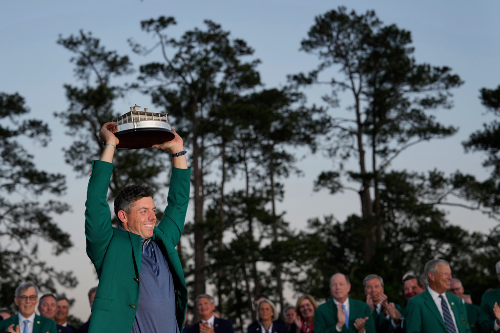 FILE - Winner Rory McIlroy, of Northern Ireland, holds the trophy at the Masters golf tournament, Sunday, April 13, 2025, in Augusta, Ga. (AP Photo/David J. Phillip, File)