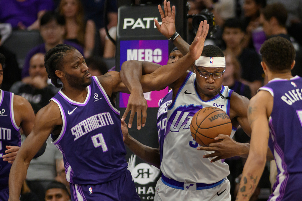 Sacramento Kings forward Precious Achiuwa (9) and Utah Jazz center Oscar Tshiebwe battle for a rebound during the second half of an NBA basketball game in Sacramento, Calif., Sunday, March 15, 2026. (AP Photo/Randall Benton)