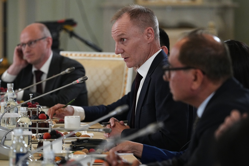 The Associated Press News Director of Europe/Africa James Jordan, center, attends Russian President Vladimir Putin's meeting with representatives of international news agencies on the sidelines of the St. Petersburg International Economic Forum at the Constantine Palace in St. Petersburg, Russia, on Thursday, June 4, 2026. (AP Photo/Dmitri Lovetsky, Pool)