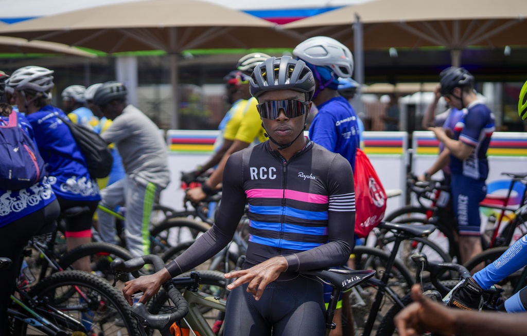 Amateur cyclists take part in a social ride on the eve of the start of the UCI road cycling world championships In Kigali, Rwanda, Saturday, Sept. 20, 2025. (AP Photo/Jerome Delay)