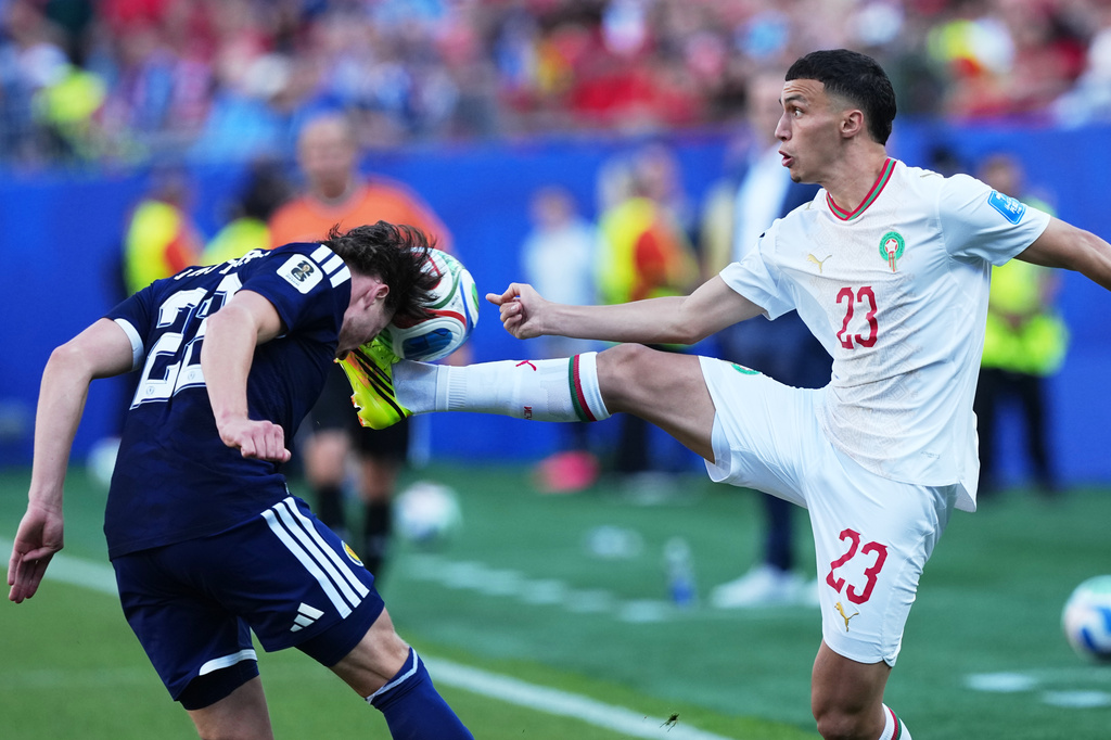 Morocco's Bilal El Khannouss, right, and Scotland's Nathan Patterson vie for the ball during the World Cup Group C soccer match between Scotland and Morocco in Foxborough, Mass., near Boston, Friday, June 19, 2026. (AP Photo/Martin Meissner)