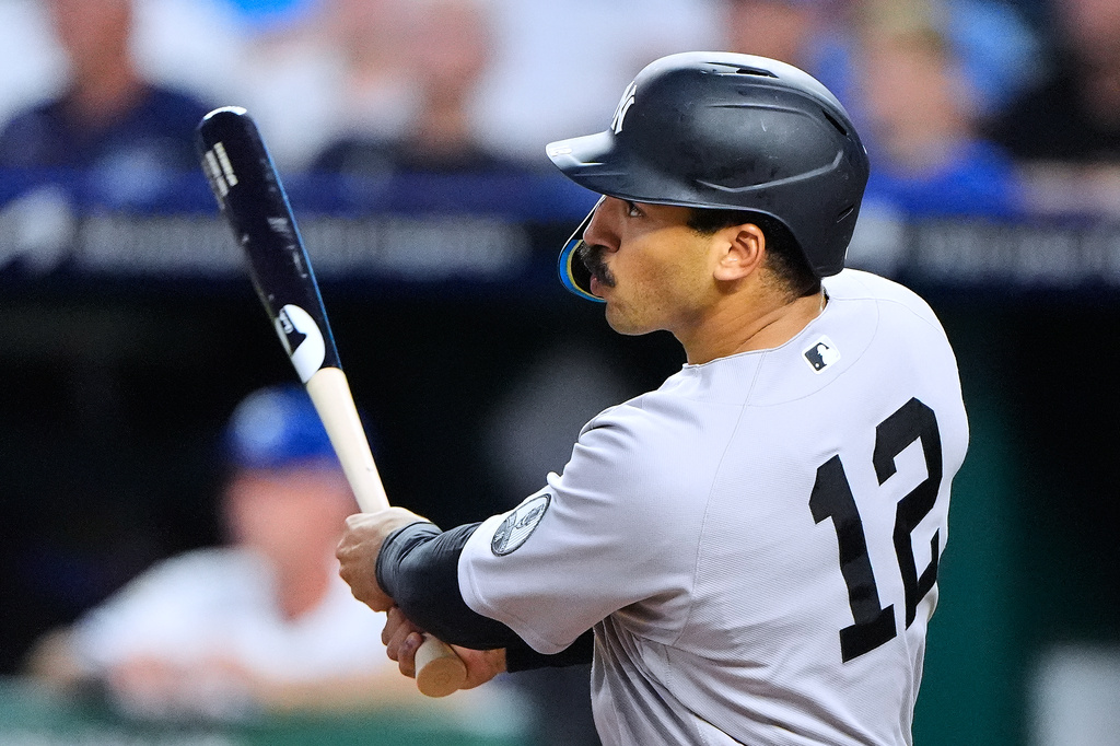 New York Yankees' Trent Grisham watches his solo home run during the seventh inning of baseball game against the Kansas City Royals, Tuesday, May 26, 2026, in Kansas City, Mo. (AP Photo/Charlie Riedel)
