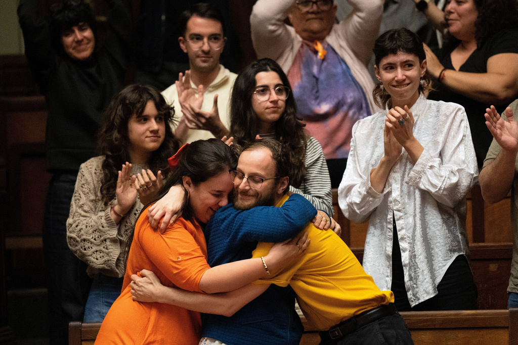 People celebrate after Uruguay's senate passed a law decriminalizing euthanasia, in Montevideo, Uruguay, Wednesday, Oct. 15, 2025. (AP Photo/Matilde Campodonico)