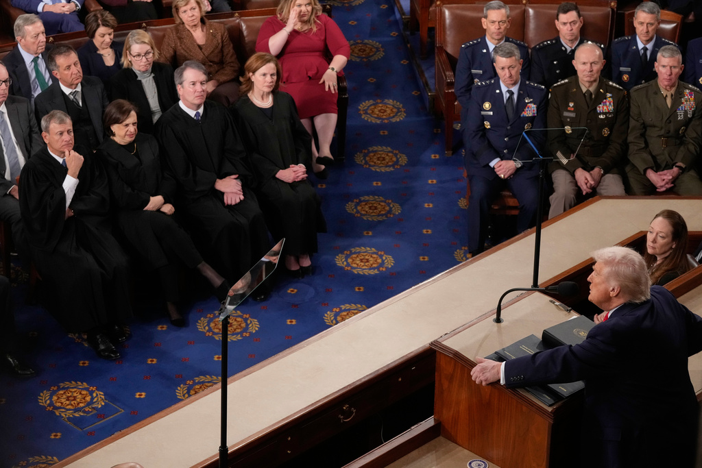 President Donald Trump delivers the State of the Union address to a joint session of Congress in the House chamber at the U.S. Capitol in Washington, Tuesday, Feb. 24, 2026, as Chief Justice of the United States John Roberts, Justice Elena Kagan, Justice Brett Kavanaugh and Justice Amy Coney Barrett listen. (AP Photo/Mark Schiefelbein)