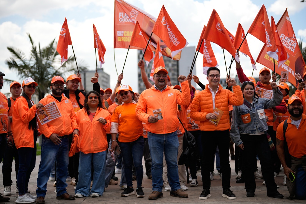 Congressman Carlos Carreño Marín, who goes by Sergio Marin, of the Comunes party, campaigns for reelection ahead of legislative elections in Bogota, Colombia, Thursday, Feb. 26, 2026. (AP Photo/Fernando Vergara)