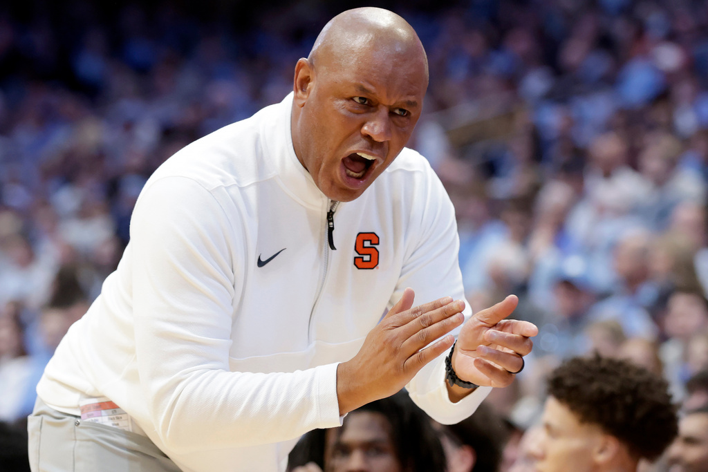Syracuse head coach Adrian Autry applauds his team's play during the first half of an NCAA college basketball game against North Carolina, Monday, Feb. 2, 2026, in Chapel Hill, N.C. (AP Photo/Chris Seward)