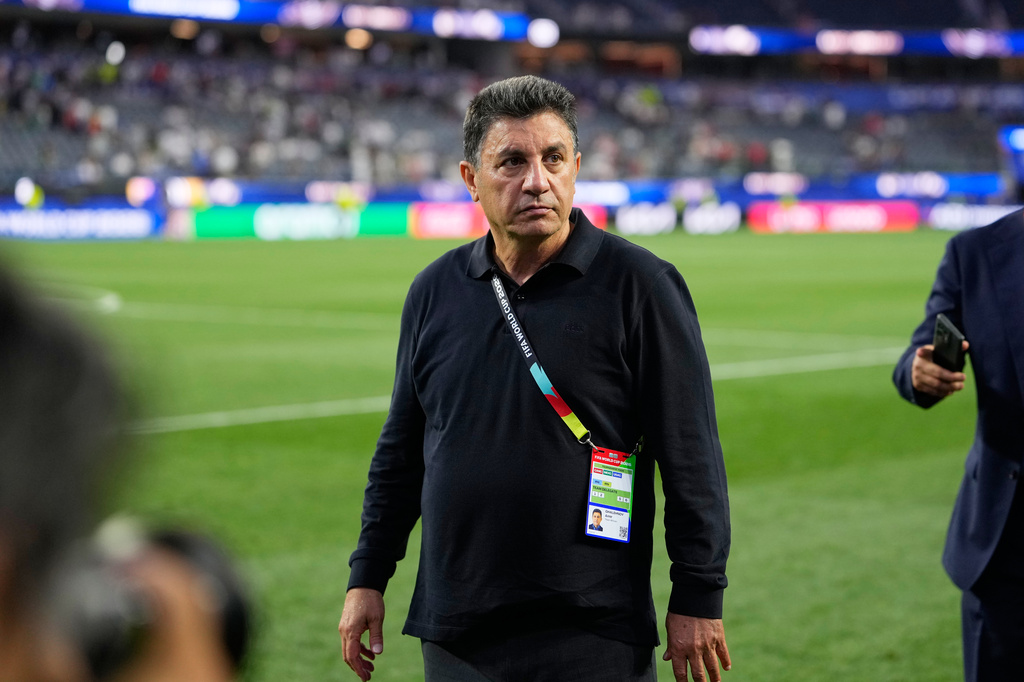 Iran head coach Amir Ghalenoei walks off the field after a draw during the World Cup Group G soccer match between Iran and New Zealand in Inglewood, Calif., near Los Angeles, Monday, June 15, 2026. (AP Photo/Mark J. Terrill)