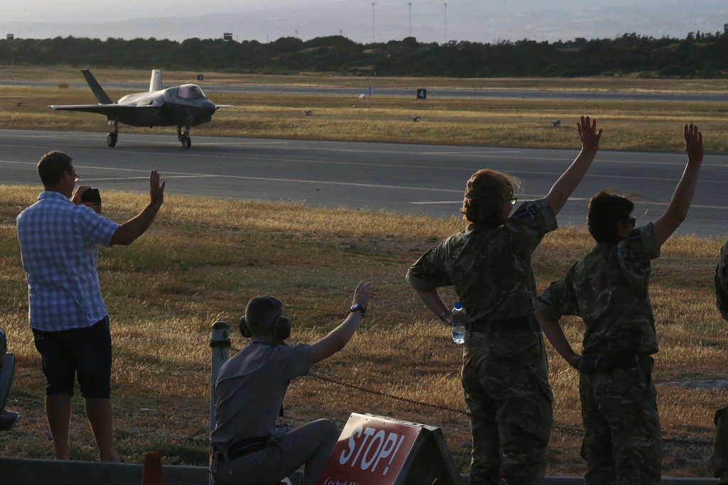FILE - British soldiers wave to the F-35B aircraft after landing at Akrotiri Royal air forces base near city of Limassol, Cyprus, May 21, 2019. (AP Photo/Petros Karadjias, File)