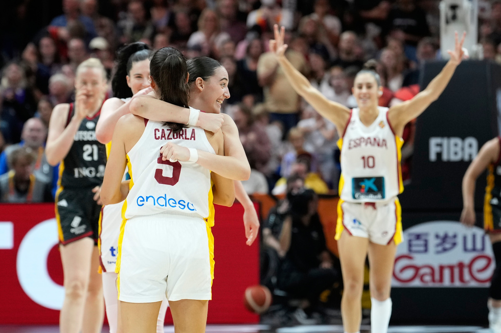 Spain's Maite Cazorla and Iyana Martín hug during the Women's Basketball World Cup the third-place match between the Germany and Spain in Berlin, Sunday, Sept. 13, 2026. (AP Photo/Ebrahim Noroozi)