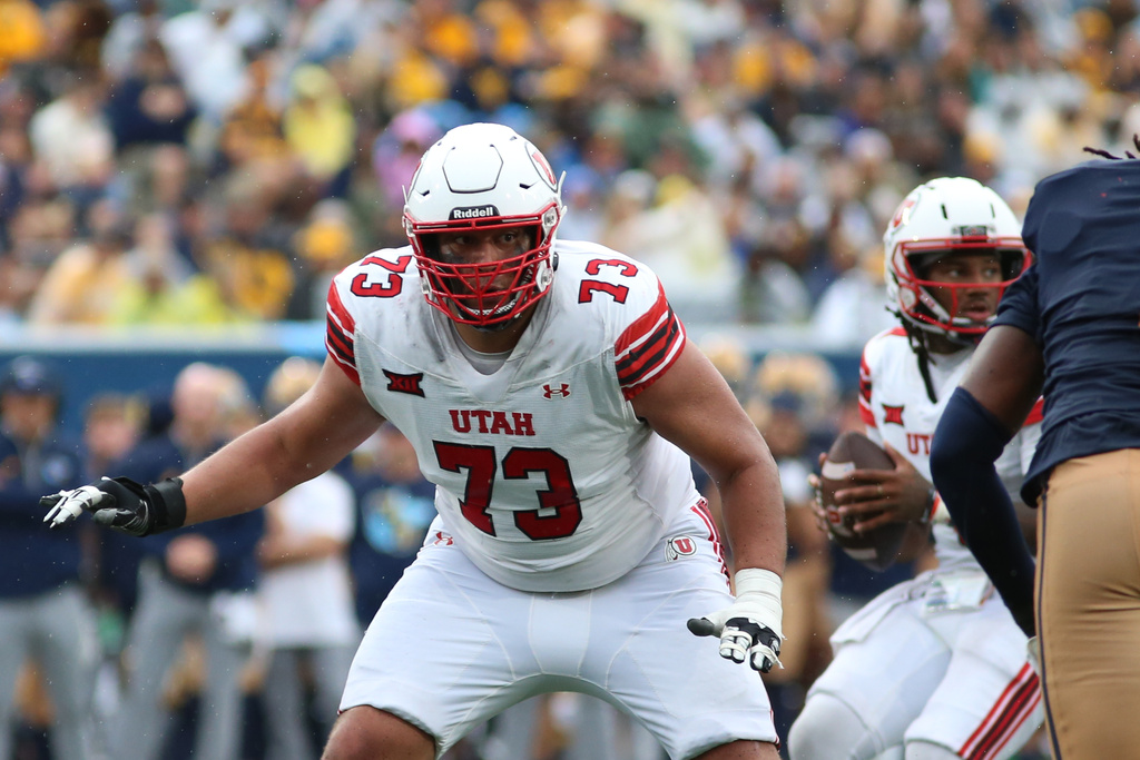 Utah offensive lineman Tanoa Togiai (73) looks to block during the second half of an NCAA college football game against West Virginia, Saturday, Sept, 27, 2025, in Morgantown, W.Va. (AP Photo/ William Wotring)