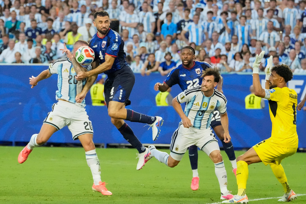 Argentina's Alexis Mac Allister (20) and Cape Verde's Pico Lopes (4) compete for the ball during the World Cup round of 32 soccer match between Argentina and Cape Verde in Miami Gardens, Fla., Friday, July 3, 2026. (AP Photo/Chris Carlson)