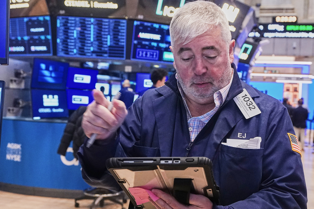 Trader Edward McCarthy works on the floor of the New York Stock Exchange, Wednesday, Feb. 11, 2026. (AP Photo/Richard Drew)