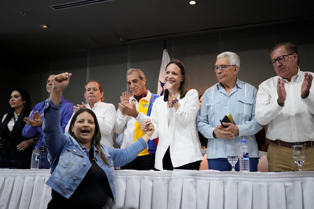 Venezuela's opposition leader Maria Corina Machado, center right, speaks during a press conference in Panama City, Saturday, May 23, 2026. (AP Photo/Matias Delacroix)