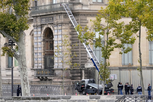 Police officers work by a basket lift used by thieves Sunday, Oct. 19, 2025 at the Louvre museum in Paris. (AP Photo/Thibault Camus) Police officers work by a basket lift used by thieves Sunday, Oct. 19, 2025 at the Louvre museum in Paris. (AP Photo/Thibault Camus)