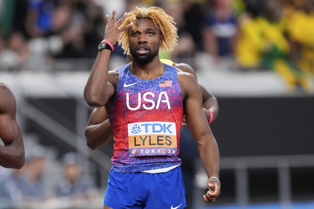 United States' Noah Lyles reacts after winning gold medal in the men's 200 meters final at the World Athletics Championships in Tokyo, Friday, Sept. 19, 2025. (AP Photo/Eugene Hoshiko)