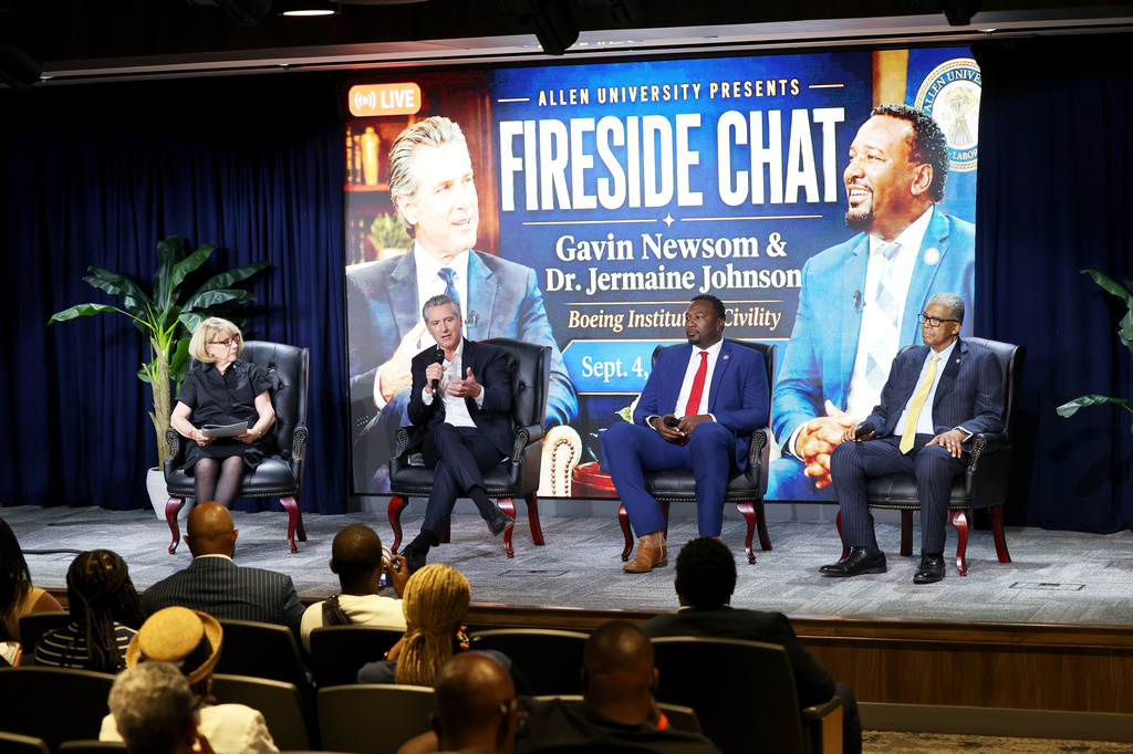 California Gov. Gavin Newsom, second from left, speaks during a fireside chat at Allen University, Friday, Sept. 4, 2026, in Columbia, S.C. (AP Photo/Mic Smith)