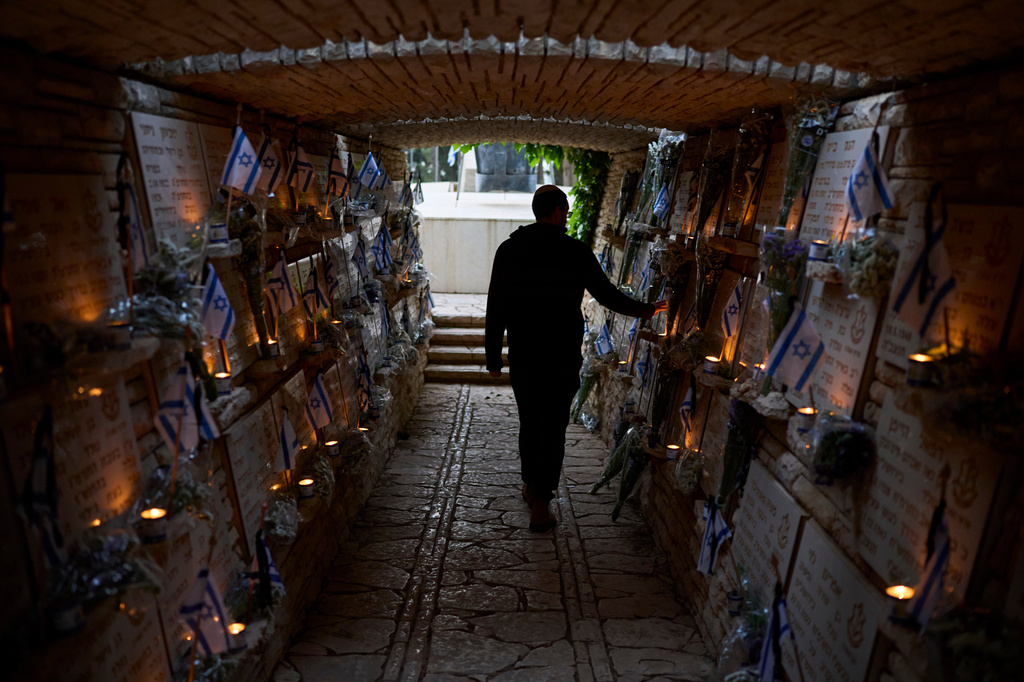 A man visits Mount Herzl military cemetery in Jerusalem on the eve of Israel's annual Memorial Day for the fallen soldiers, Monday, April 20, 2026. (AP Photo/Ohad Zwigenberg)