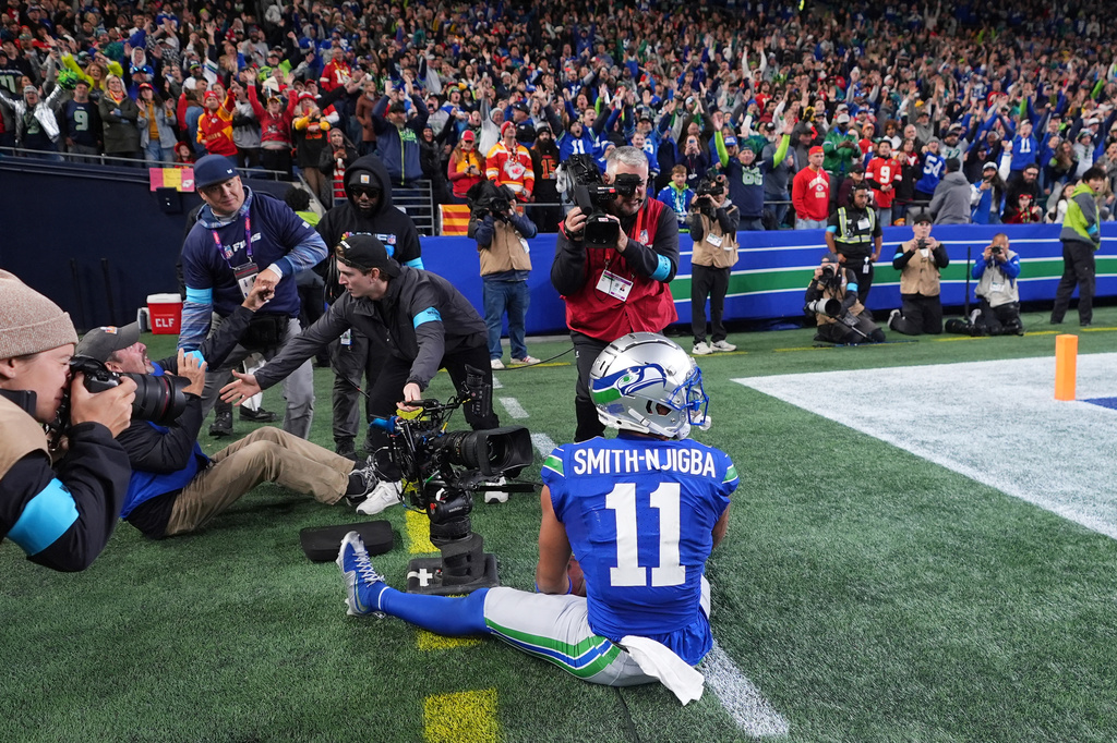 Seattle Seahawks wide receiver Jaxon Smith-Njigba (11) reacts after a catch for a touchdown during the first half of an NFL football game against the Kansas City Chiefs in Seattle, Sunday, Oct. 25, 2026. (AP Photo/Lindsey Wasson)