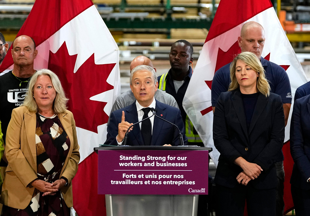 Minister of Finance and National Revenue Francois-Philippe Champagne speaks at a news conference on Canada's response to U.S. tariffs, at a roofing company in Ottawa, on Tuesday, Aug. 25, 2026. (Justin Tang/The Canadian Press via AP)