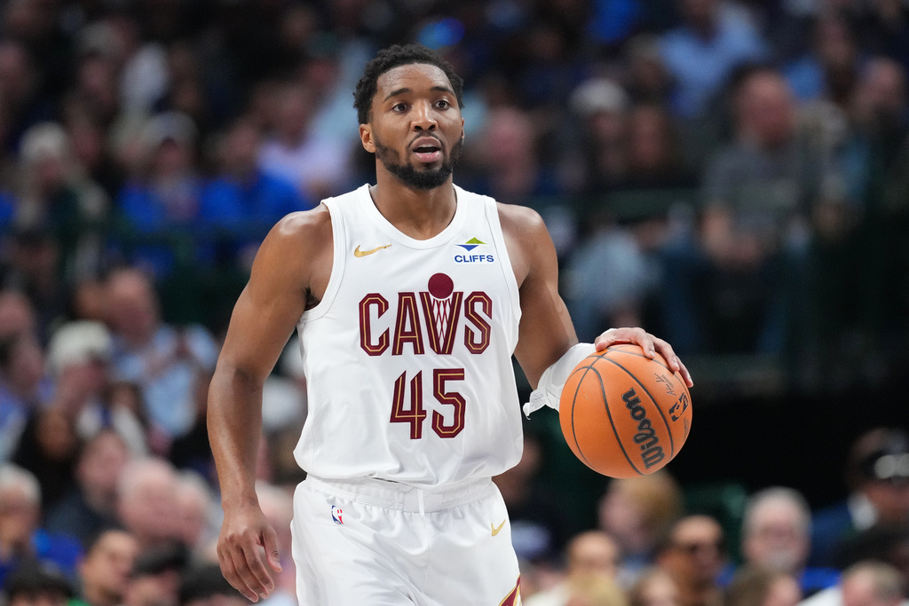 Cleveland Cavaliers guard Donovan Mitchell dribbles up court against the Dallas Mavericks during the second half of an NBA basketball game Friday, March 13, 2026, in Dallas. (AP Photo/Julio Cortez)