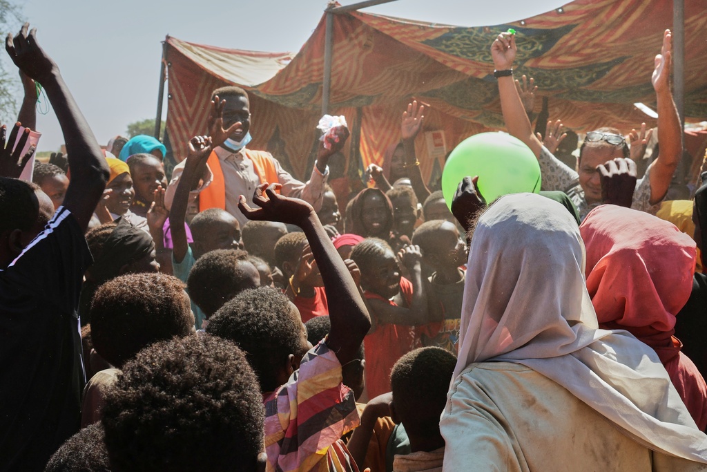 This photo released by The Norwegian Refugee Council (NRC), shows displaced children from el-Fasher playing at a camp where they sought refuge from fighting between government forces and the RSF, in Tawila, Darfur region, Sudan, Monday, Nov. 3, 2025. (Sarah Vuylsteke/NRC via AP)