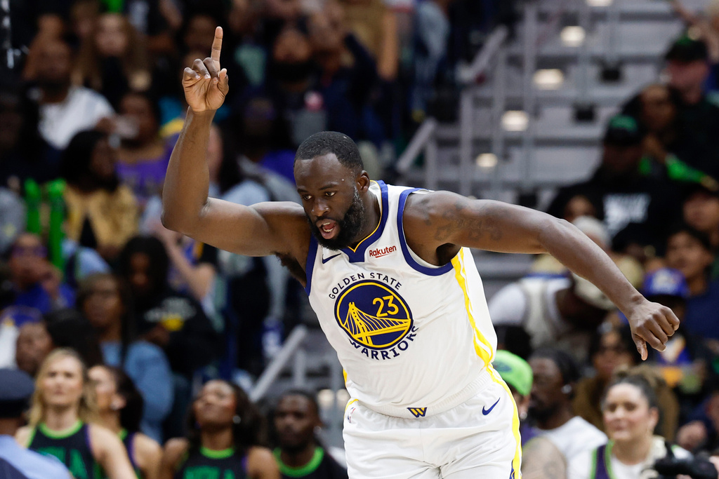 Golden State Warriors forward Draymond Green reacts after a basket against the New Orleans Pelicans during the third quarter of an NBA basketball game, Sunday, Nov. 16, 2025, in New Orleans. (AP Photo/Butch Dill)