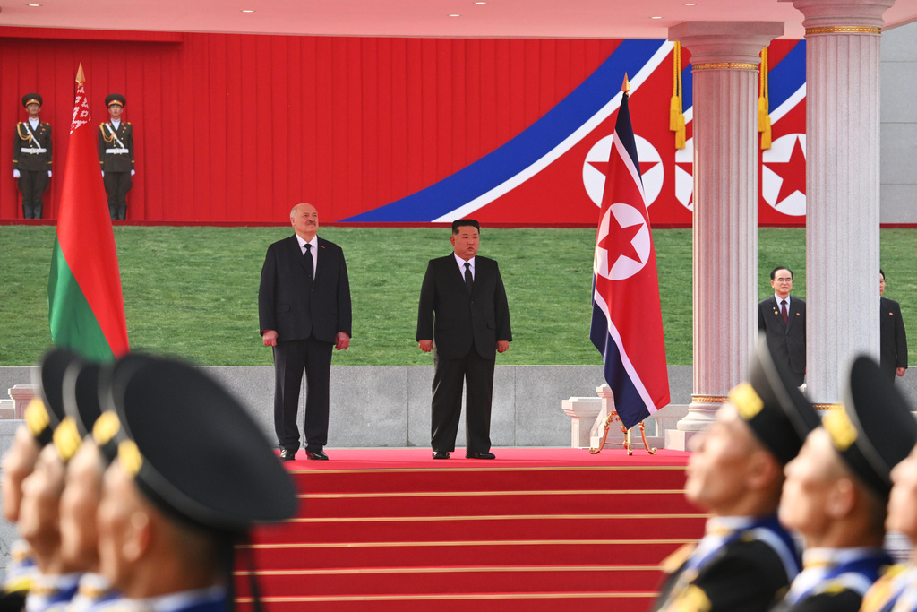 In this photo released by Belarus' Presidential Press Service, North Korea's leader Kim Jong Un, right, and Belarusian President Alexander Lukashenko, left, attend an official meeting ceremony in Pyongyang, North Korea, Wednesday, March 25, 2026. (Belarus' Presidential Press Service via AP)