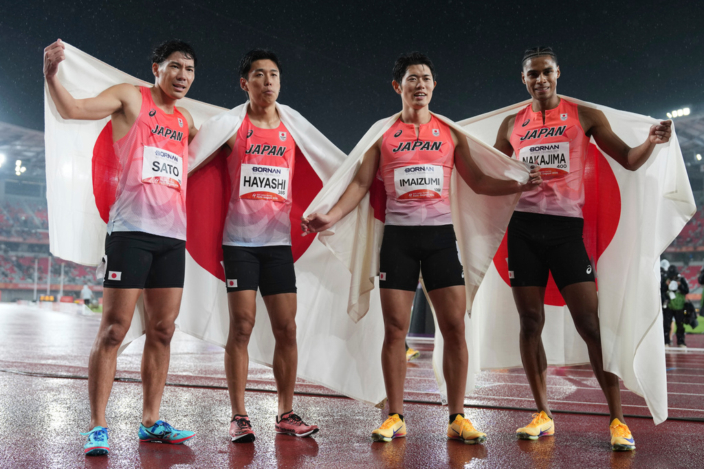 Japan's men's 4 x 400m relay team from left, Fuga Sato, Shinya Hayashi, Kenji Imaizumi and Yuki Joseph Nakajima react after winning gold at the Asian Games in Nagoya, Japan, Tuesday, Sept. 29, 2026. (AP Photo/Lee Jin-man)