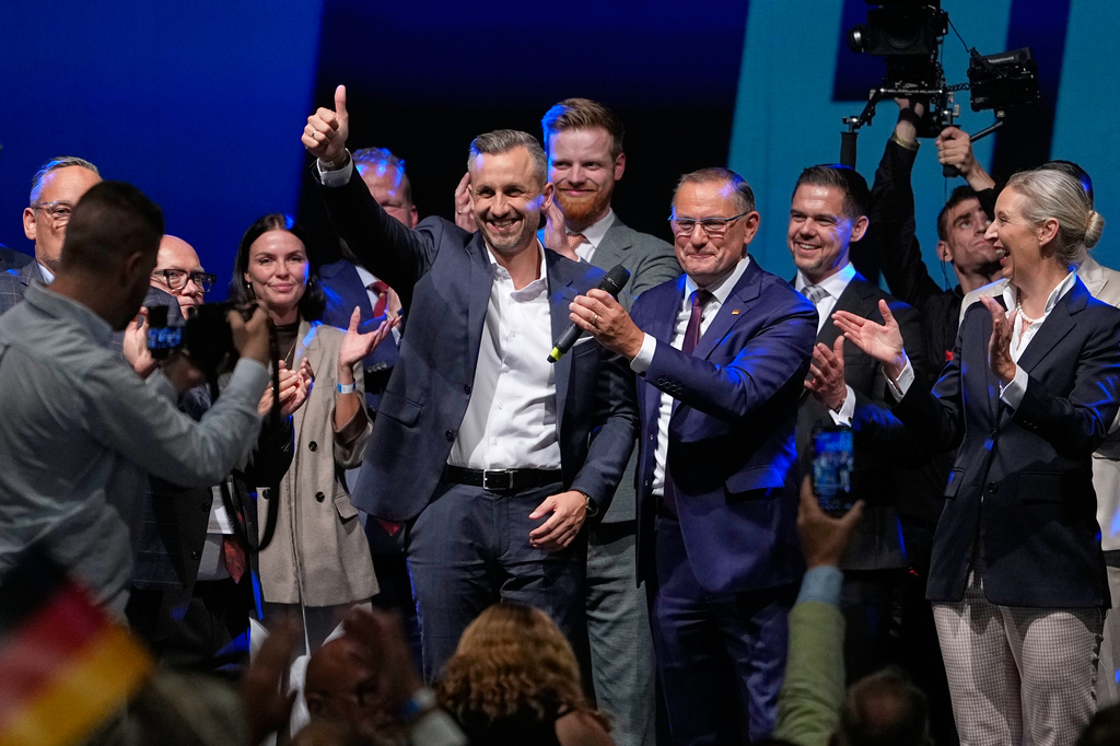 Top candidate Ulrich Siegmund shows thumbs up beside party leaders Tino Chrupalla and Alice Weidel, from left, at an election party of the "Alternative for Germany" (AfD) after the Saxony-Anhalt state elections in Magdeburg, eastern Germany, Sunday, Sept. 6, 2026. (AP Photo/Matthias Schrader)