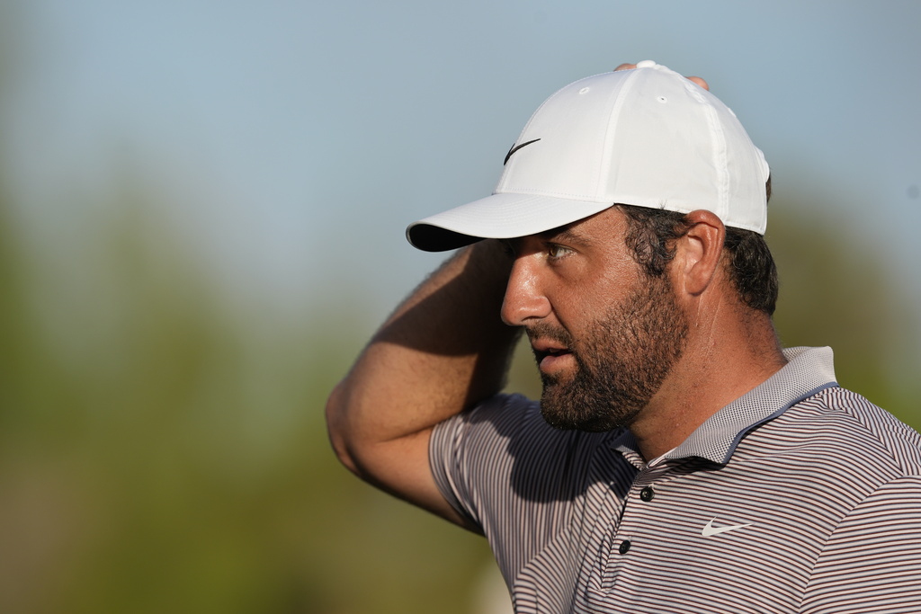 Scottie Scheffler, of the United States, reacts after the 18th hole the final round of the Hero World Challenge PGA Tour at the Albany Golf Club, in New Providence, Bahamas, Sunday, Dec. 7, 2025. (AP Photo/Fernando Llano)