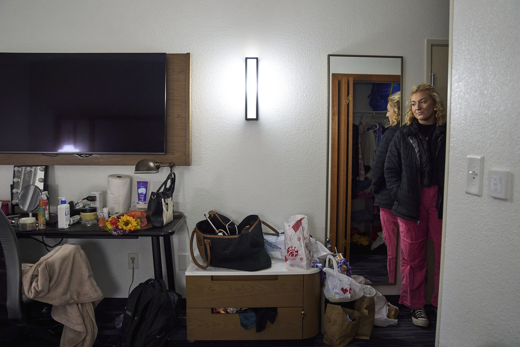 Gwendolyn Bode looks at the hotel room where she is temporarily living in Boone, N.C., on Thursday, Dec. 5, 2024, after being displaced from her apartment that was damaged during Hurricane Helene. (AP Photo/Stephanie Scarbrough)
