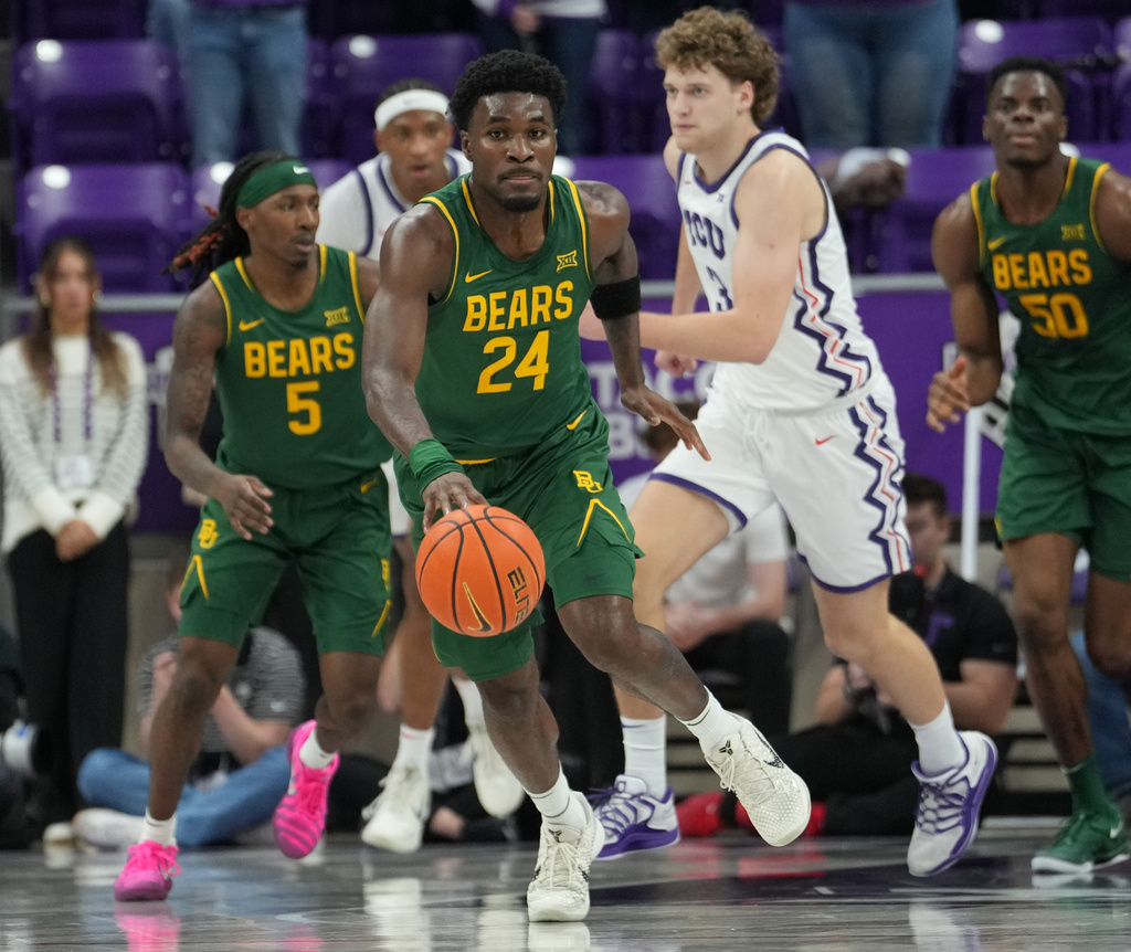 Baylor guard Tounde Yessoufou (24) pushes the ball upcourt ahead of TCU guard Liutauras Lelevicius (3) in the first half of an NCAA college basketball game, Saturday, Jan.3, 2026, in Fort Worth, Texas. (Chris Jones/Waco Tribune-Herald via AP)