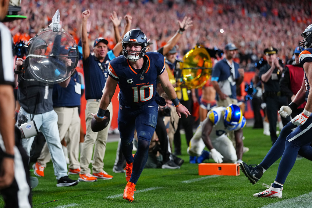 Denver Broncos quarterback Bo Nix reacts after a play against the Los Angeles Rams during the second half of an NFL football game Sunday, Sept. 27, 2026, in Denver. (AP Photo/Jack Dempsey)