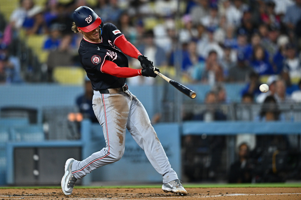 Washington Nationals' Brady House hits a single during the second inning of a baseball game against the Los Angeles Dodgers, Friday, Sept. 4, 2026, in Los Angeles. (AP Photo/William Liang)