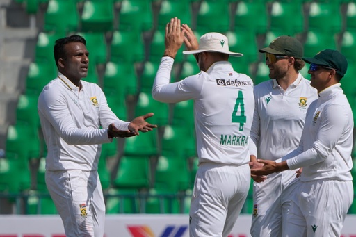 South Africa's Senuran Muthusamy, left, celebrates with teammates after taking the wicket of Pakistan's Mohammad Rizwan during the second day of the first test cricket match between Pakistan and South Africa, in Lahore, Pakistan, Monday, Oct. 13, 2025. (AP Photo/K.M. Chaudary) South Africa's Senuran Muthusamy, left, celebrates with teammates after taking the wicket of Pakistan's Mohammad Rizwan during the second day of the first test cricket match between Pakistan and South Africa, in Lahore, Pakistan, Monday, Oct. 13, 2025. (AP Photo/K.M. Chaudary)