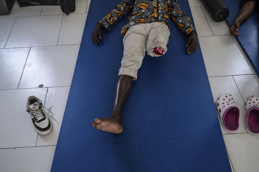 A victim of fighting in the region, waits for physiotherapy at an orthopedic center run by the Catholic church and supported by Red Cross in Goma, eastern Congo, Friday, Aug. 29, 2025. (AP Photo/Moses Sawasawa)