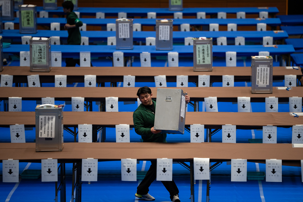 Staff prepare to count the votes for the lower house election in Tokyo, Sunday, Feb. 8, 2026. (AP Photo/Louise Delmotte)