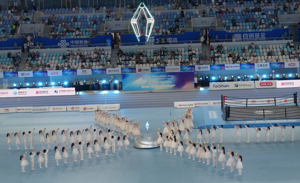 Children's performs during the closing ceremony of the World Humanoid Robot Games in Beijing, Wednesday, Aug. 26, 2026. (AP Photo/Achmad Ibrahim)